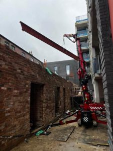 Crane Lifting Steel Beam Onto Building Rotated