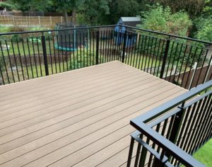 Black Outdoor Railings On Raised Decking In Garden