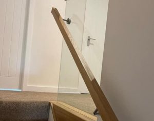 Frameless Glass Balustrade With Oak Handrails On Interior Stairs