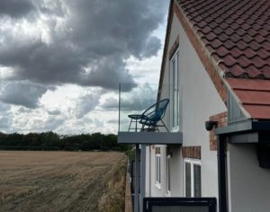 Freestanding Frameless Glass Balcony On House Side View