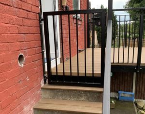 Metal Gates On Raised Decking Area