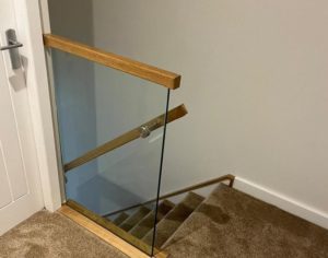 Staircase Balcony With Frameless Glass And Oak Handrail