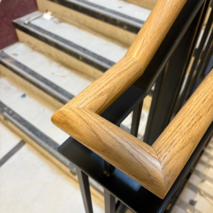 custom designed black metal balustrade with oak handrail