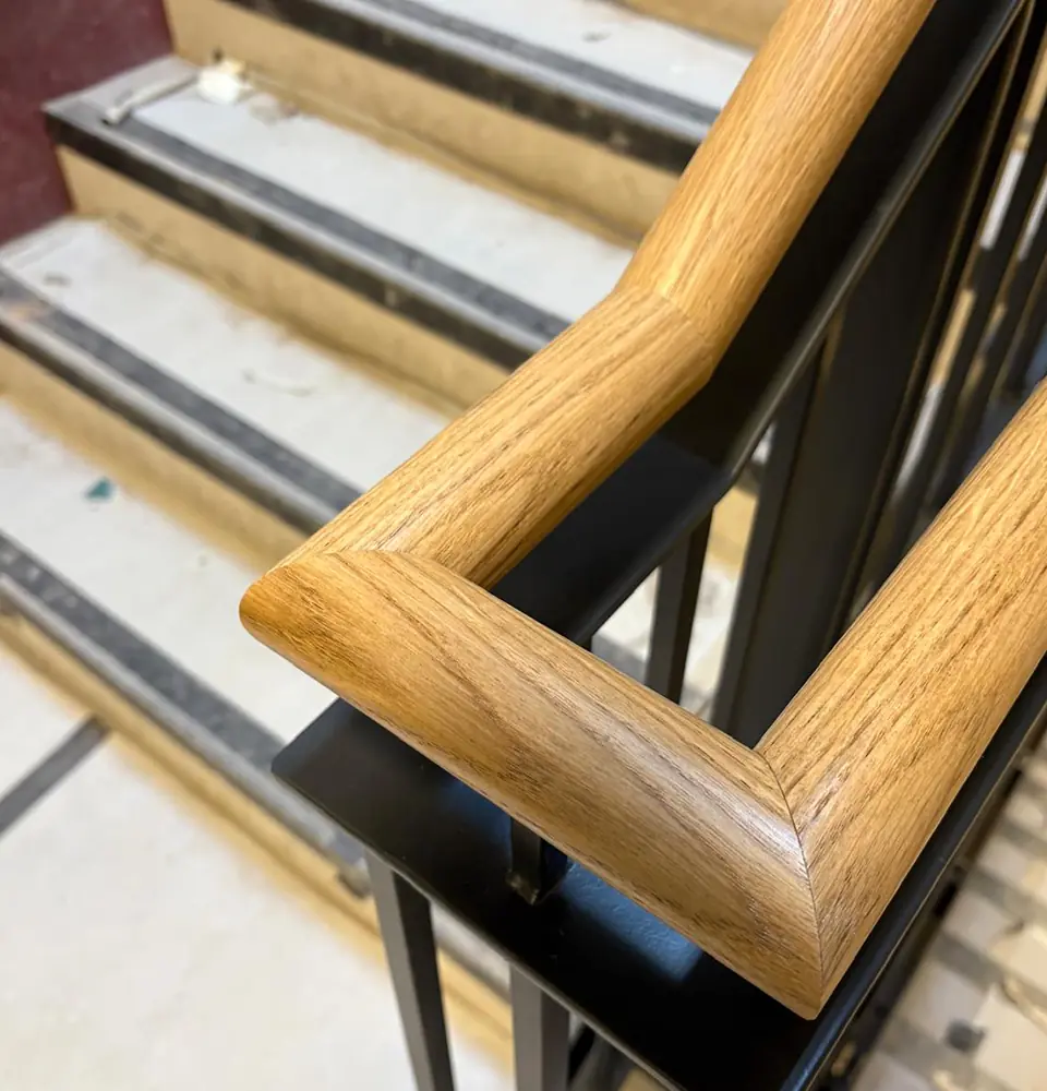 custom designed black metal balustrade with oak handrail
