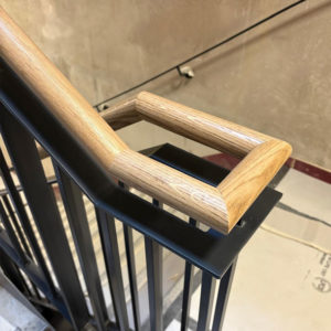 custom designed black metal balustrade with oak handrail side