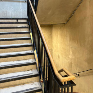 custom designed black metal balustrade with oak handrail staircase view