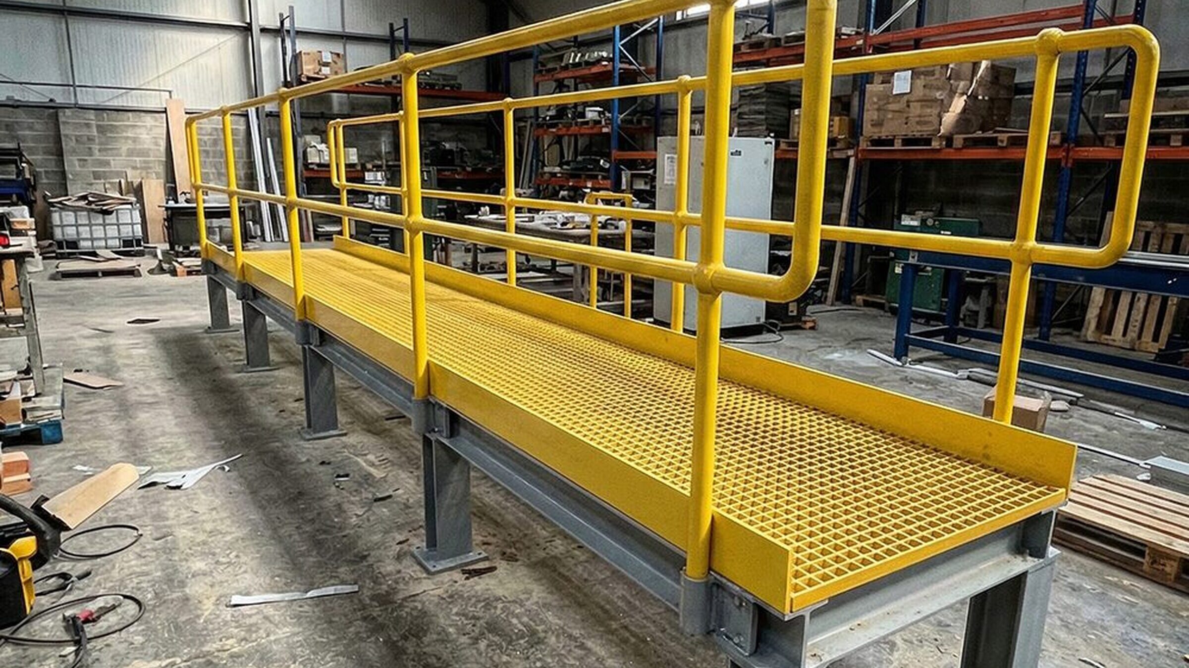 UIS team assembling a lightweight GRP walkway in the workshop