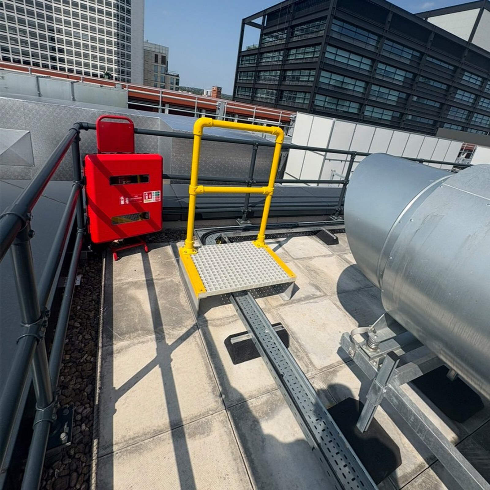 GRP panels supported over rooftop cable trays without penetrating the covering