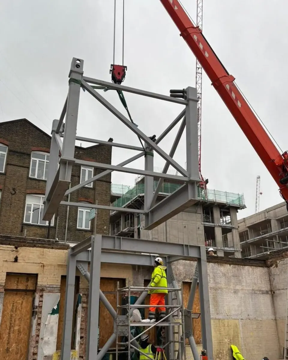 crane installing steelwork in london december 2025