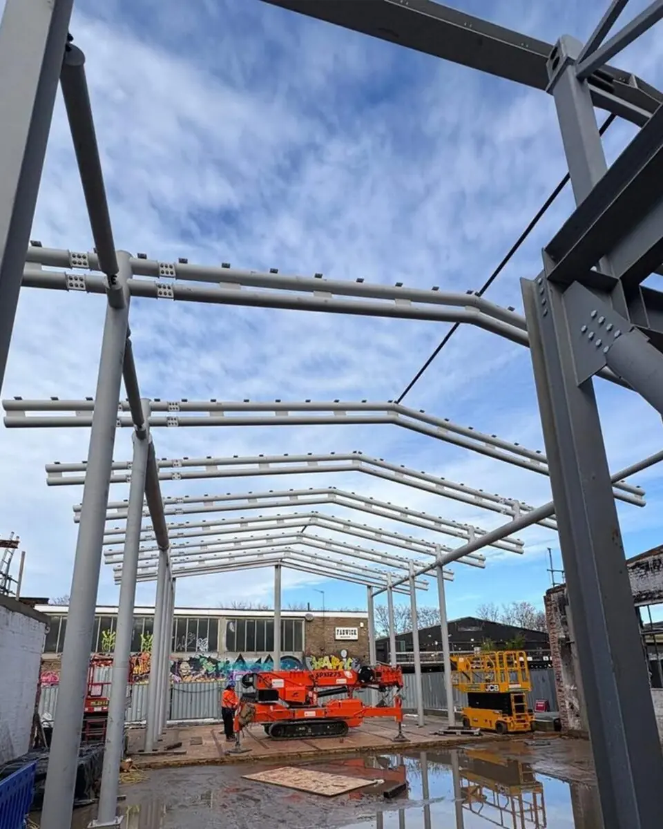side view portal frame building london 2025